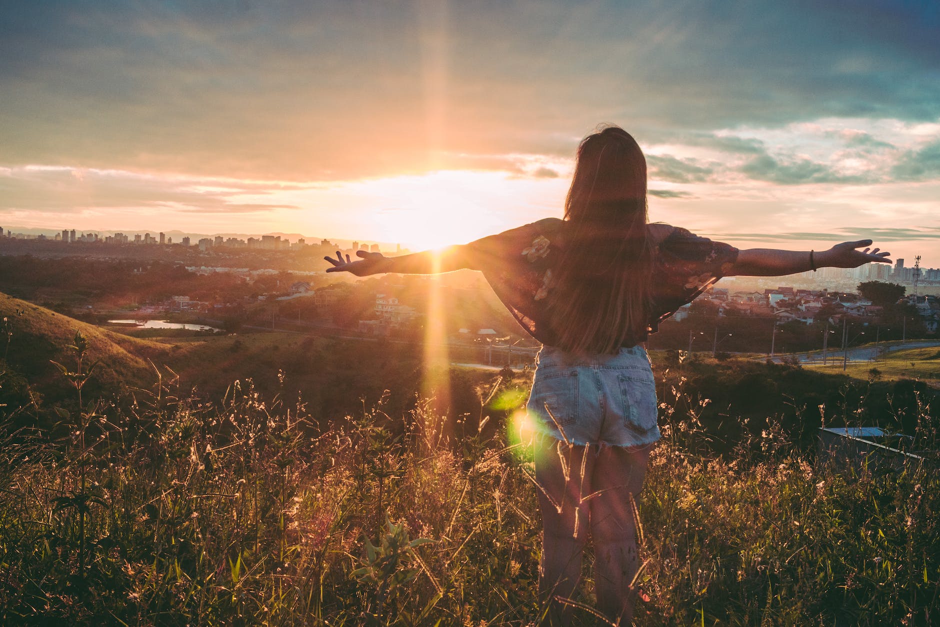 woman in nature enjoying sunrise